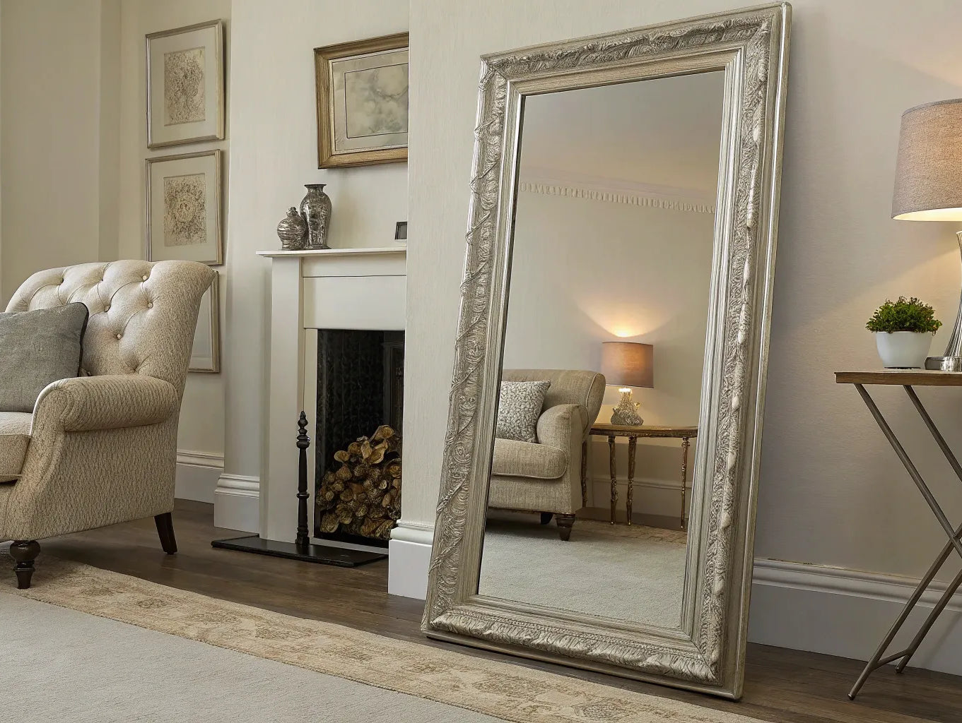 A styled oversized floor mirror leaning against a living room wall to amplify natural light.